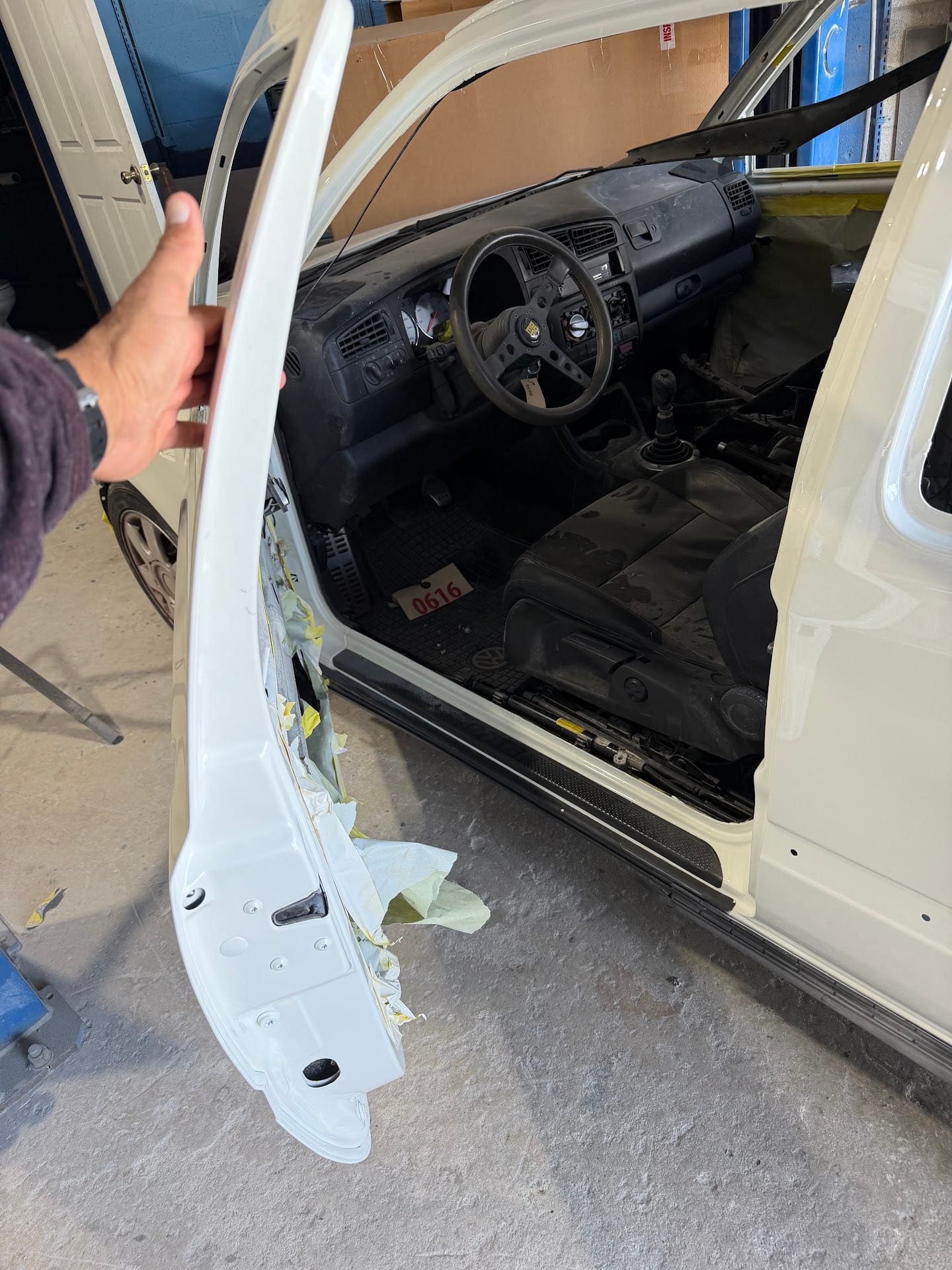Door jamb of the VW Golf prepped and primed
